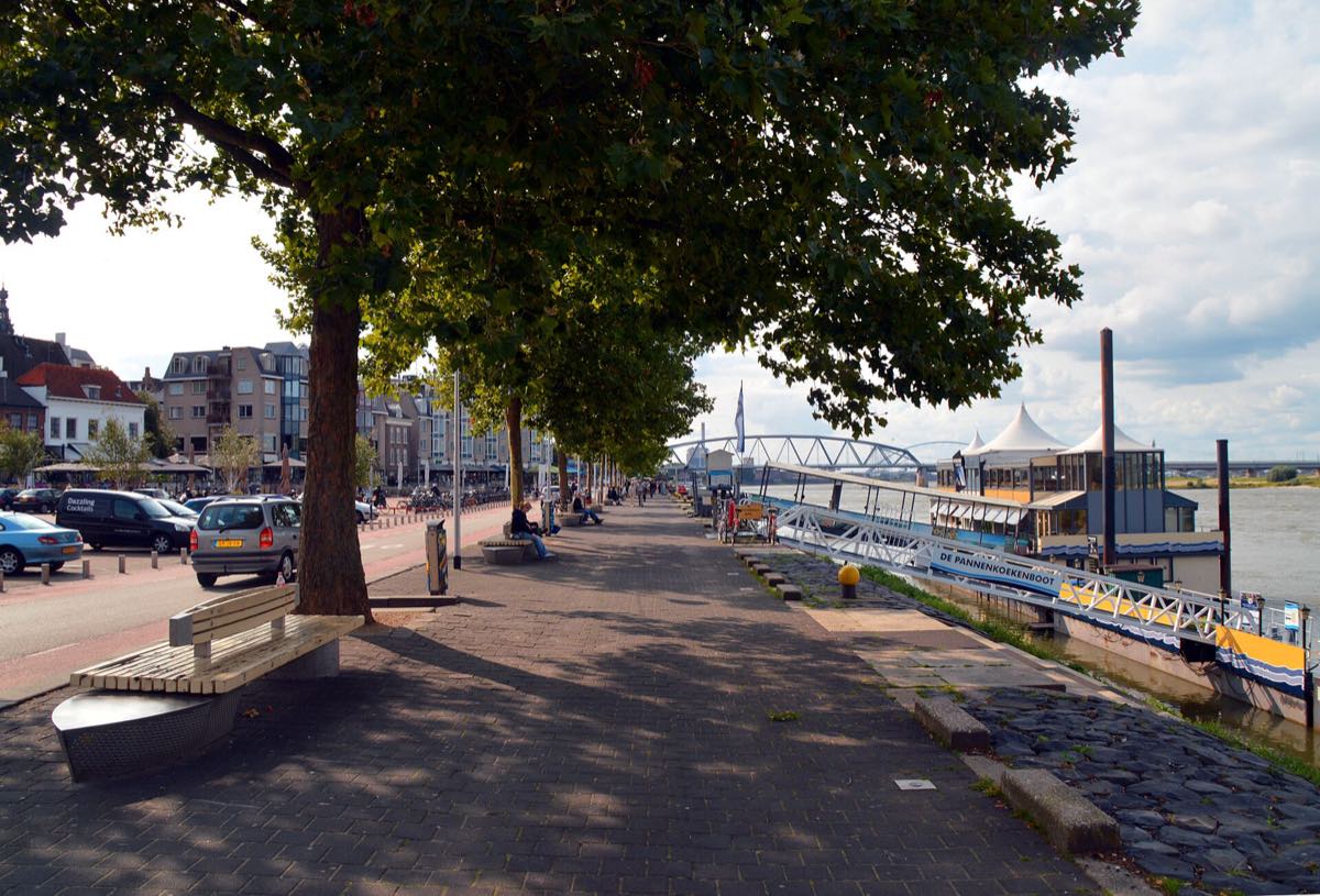 Walking along the Waal riverfront in the historic lower town of Nijmegen